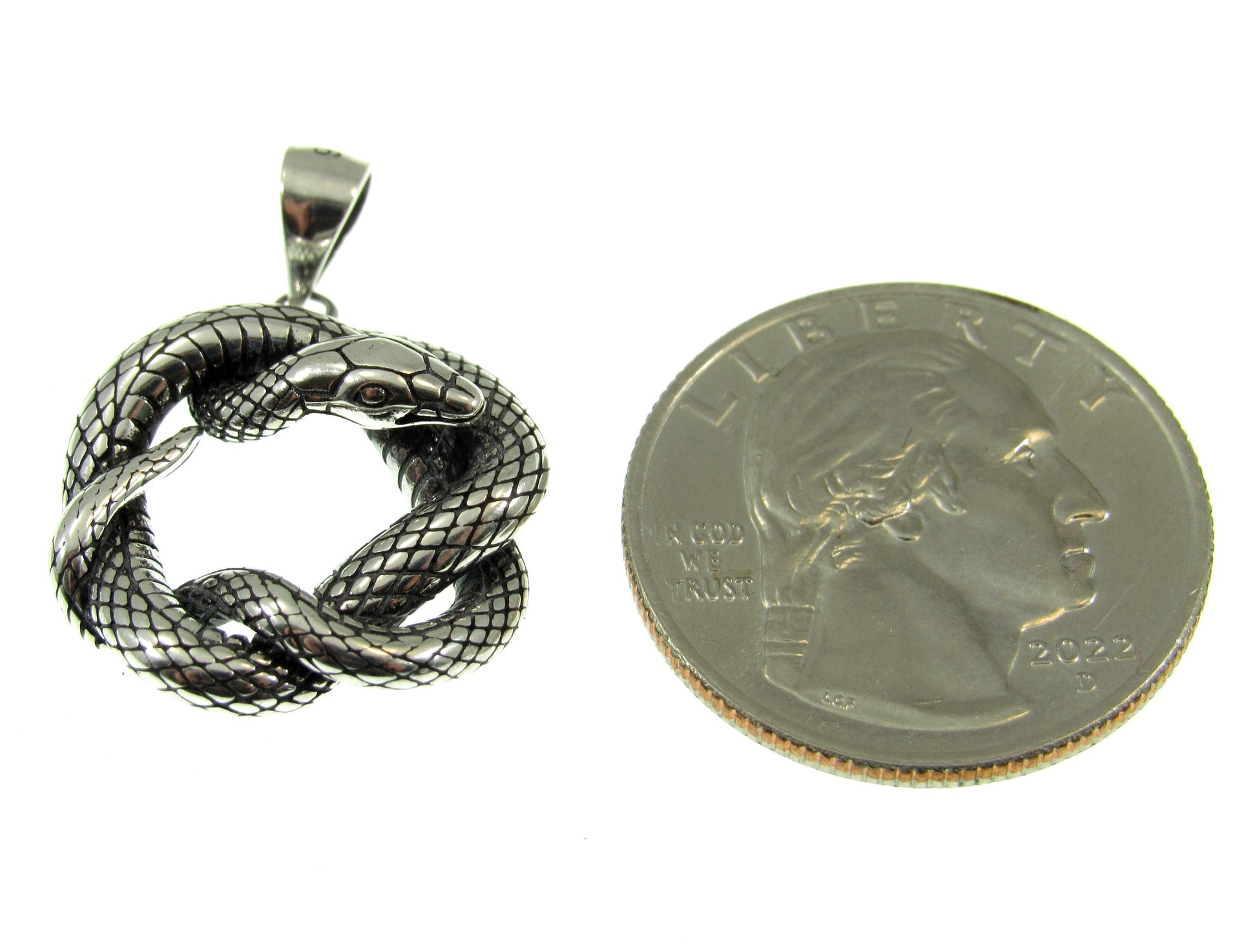 A bit smaller than a US quarter, the intertwined snake pendant weighs 3.6 grams and measures 1 1/8 inches including the bail.