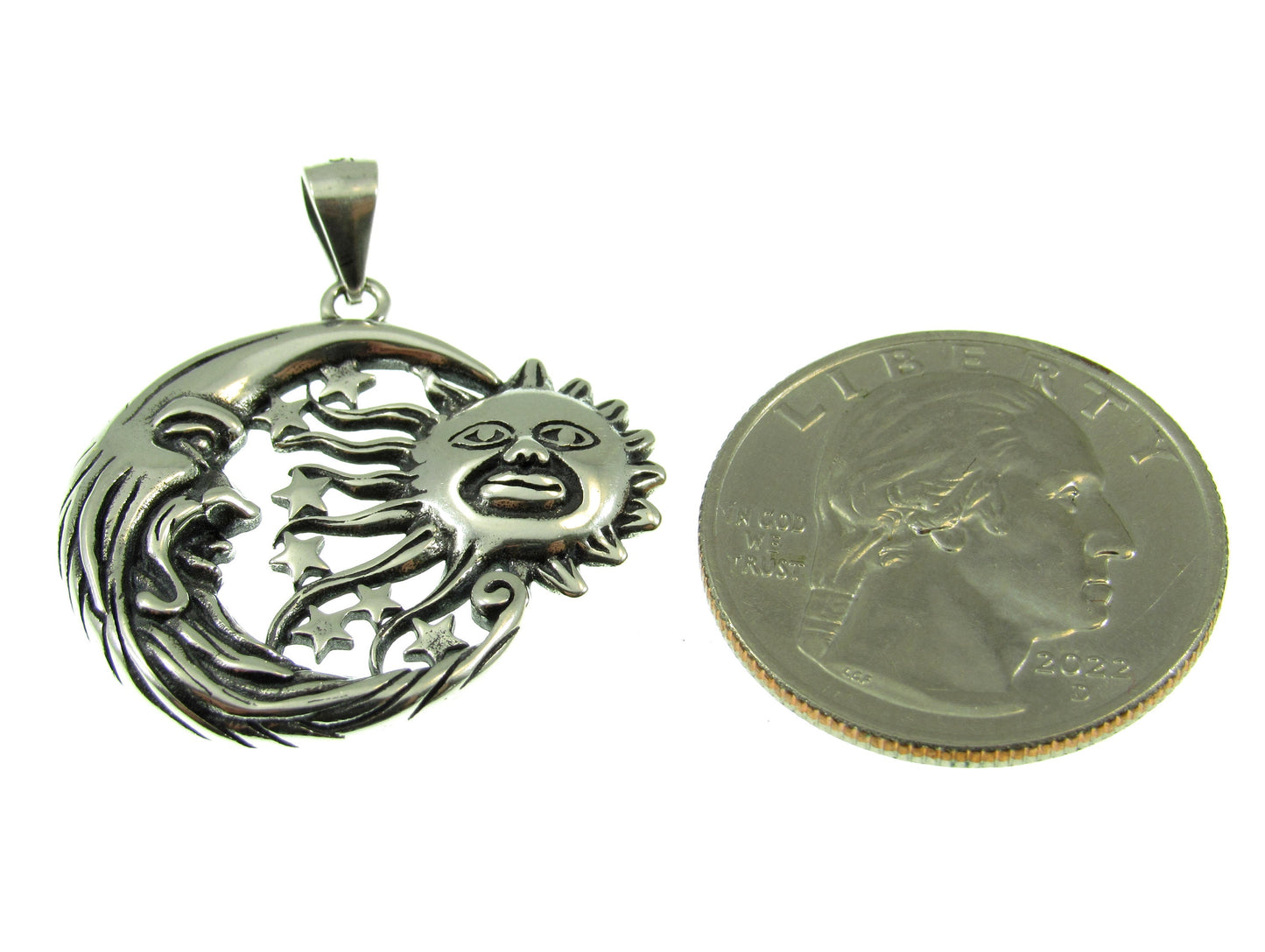 Measuring roughly the size of a US quarter, the sun moon and stars pendant measures 1 1/4 inches including the bail.