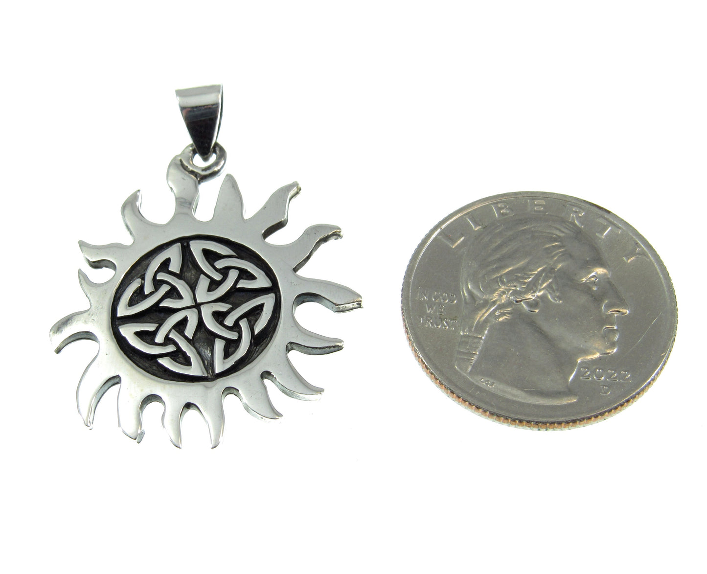 Roughly the same size as a US quarter, the sterling silver Celtic sun pendant measures 1 1/2 inches long including the bail and 1 1/8 inches wide