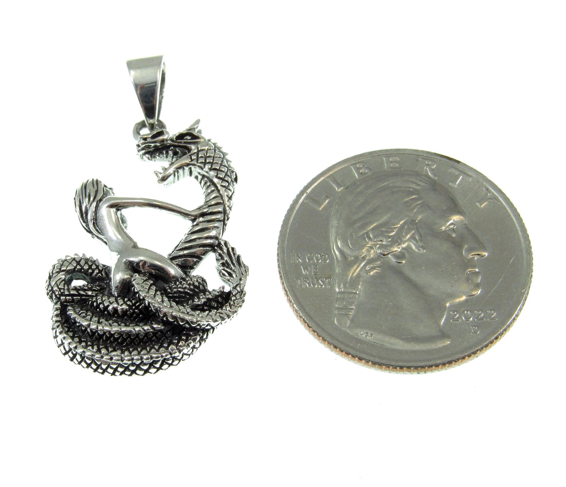 Roughly the overall size of a US quarter, the damsel in distress pendant measures 1 3/8 inches long and 3/4 inches wide