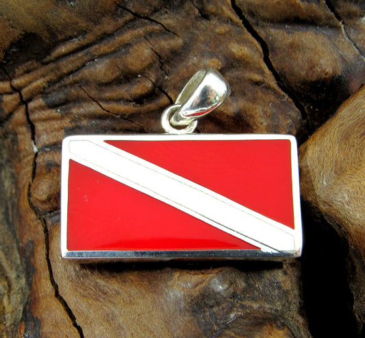 The diver down pendant is made of solid sterling silver with red and white enamel inlay to form the classic scuba diver flag.