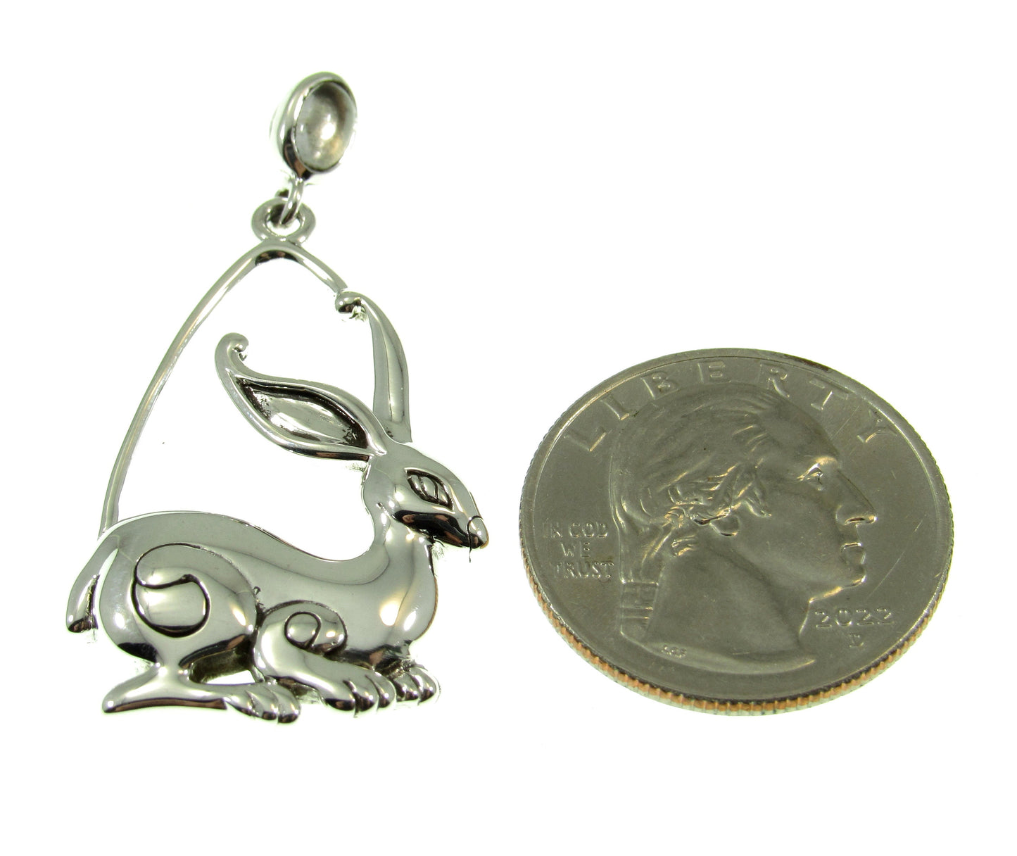 A bit larger than a US quarter, the sterling silver rabbit ostara pendant measures 1 3/4 inches long by 7/8 inches wide.