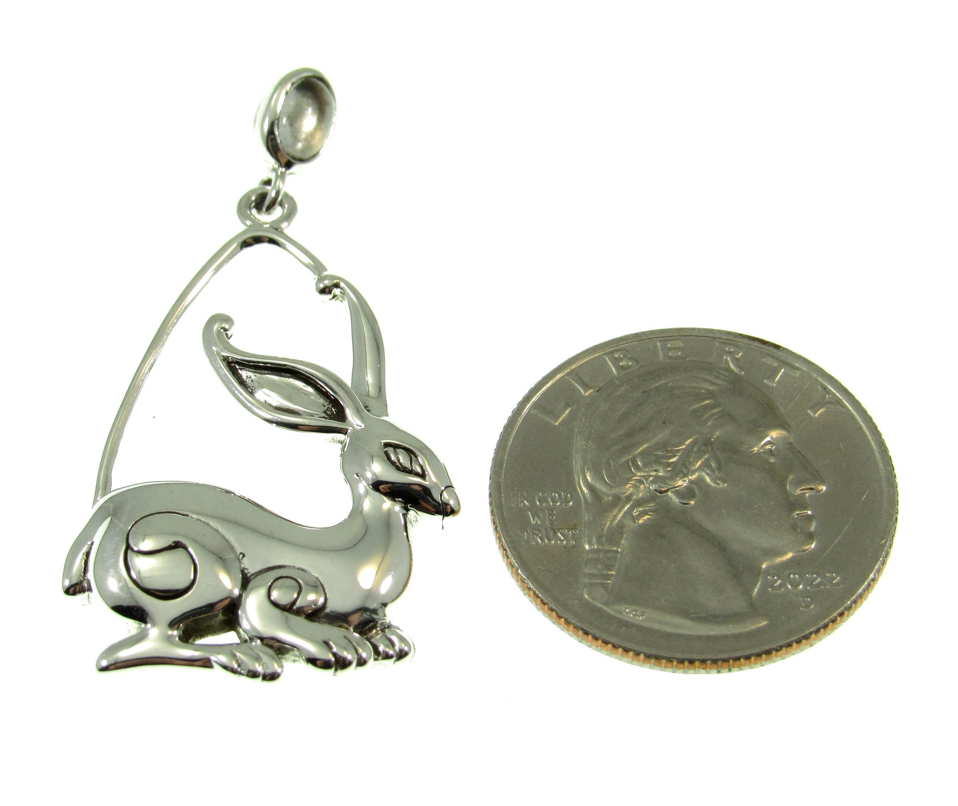 A bit larger than a US quarter, the sterling silver rabbit ostara pendant measures 1 3/4 inches long by 7/8 inches wide.