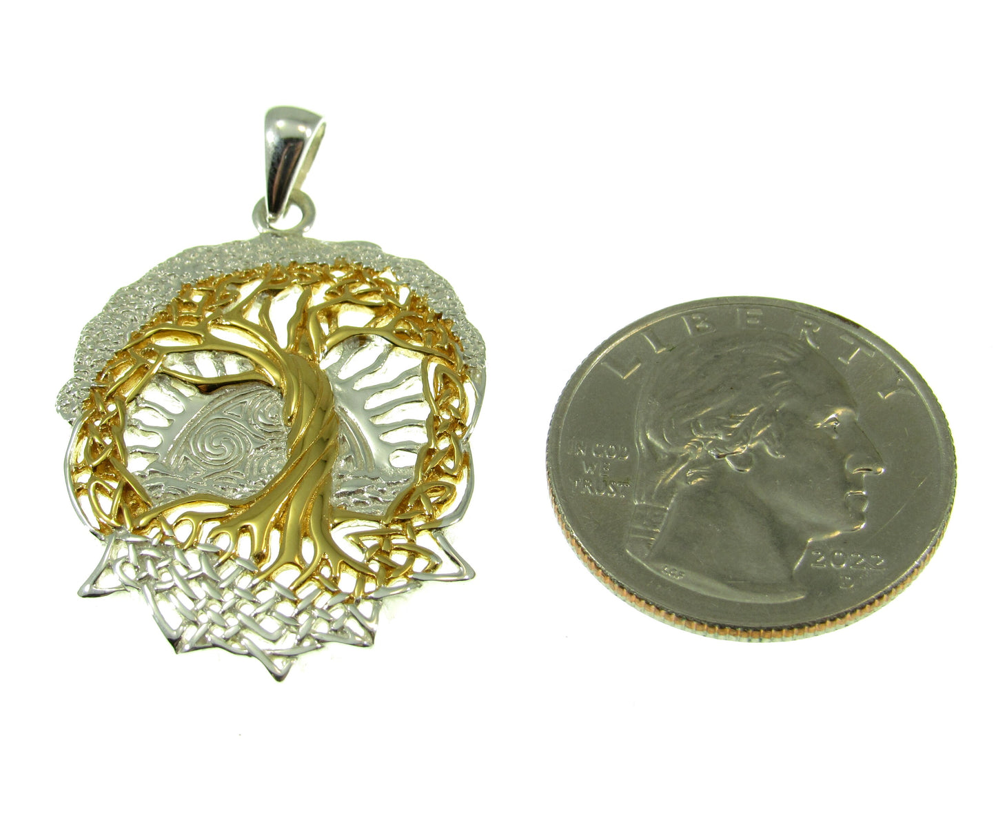 Larger than a US quarter, the solid sterling silver and gold vermeil tree of life pendant measures 1 5/8 inches long by 1 inch wide.