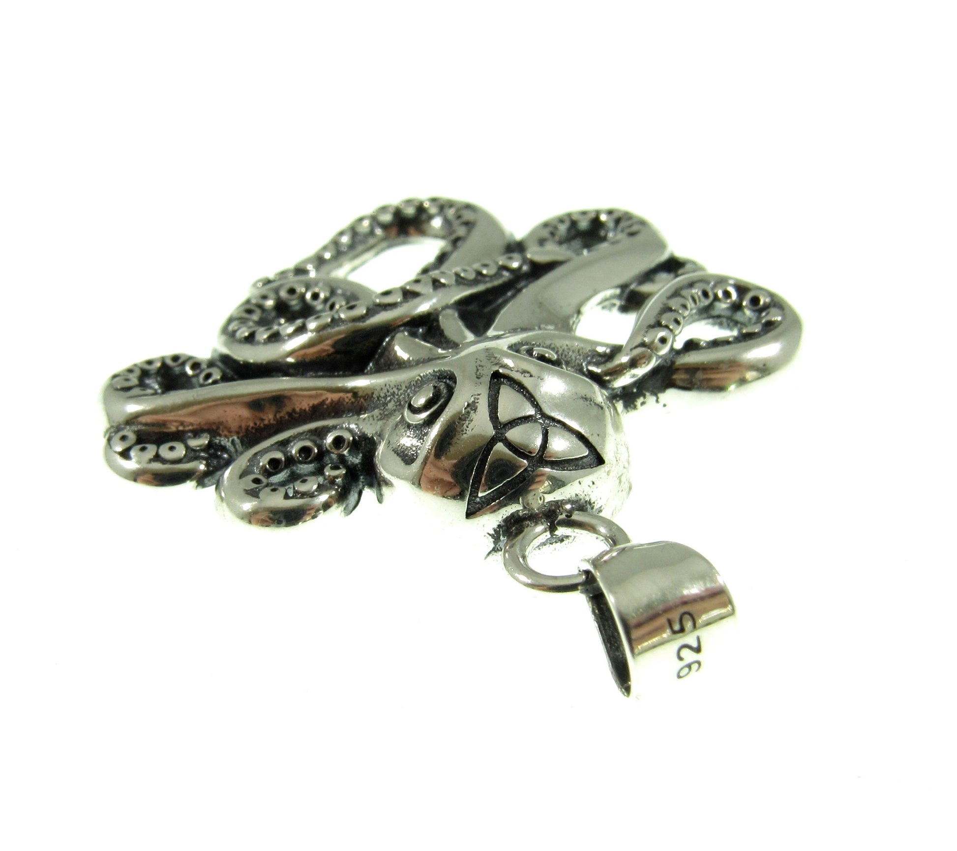 The octopus with tentacles pendant is quality stamped 925 for purity and weighs 5.1 grams of solid sterling silver