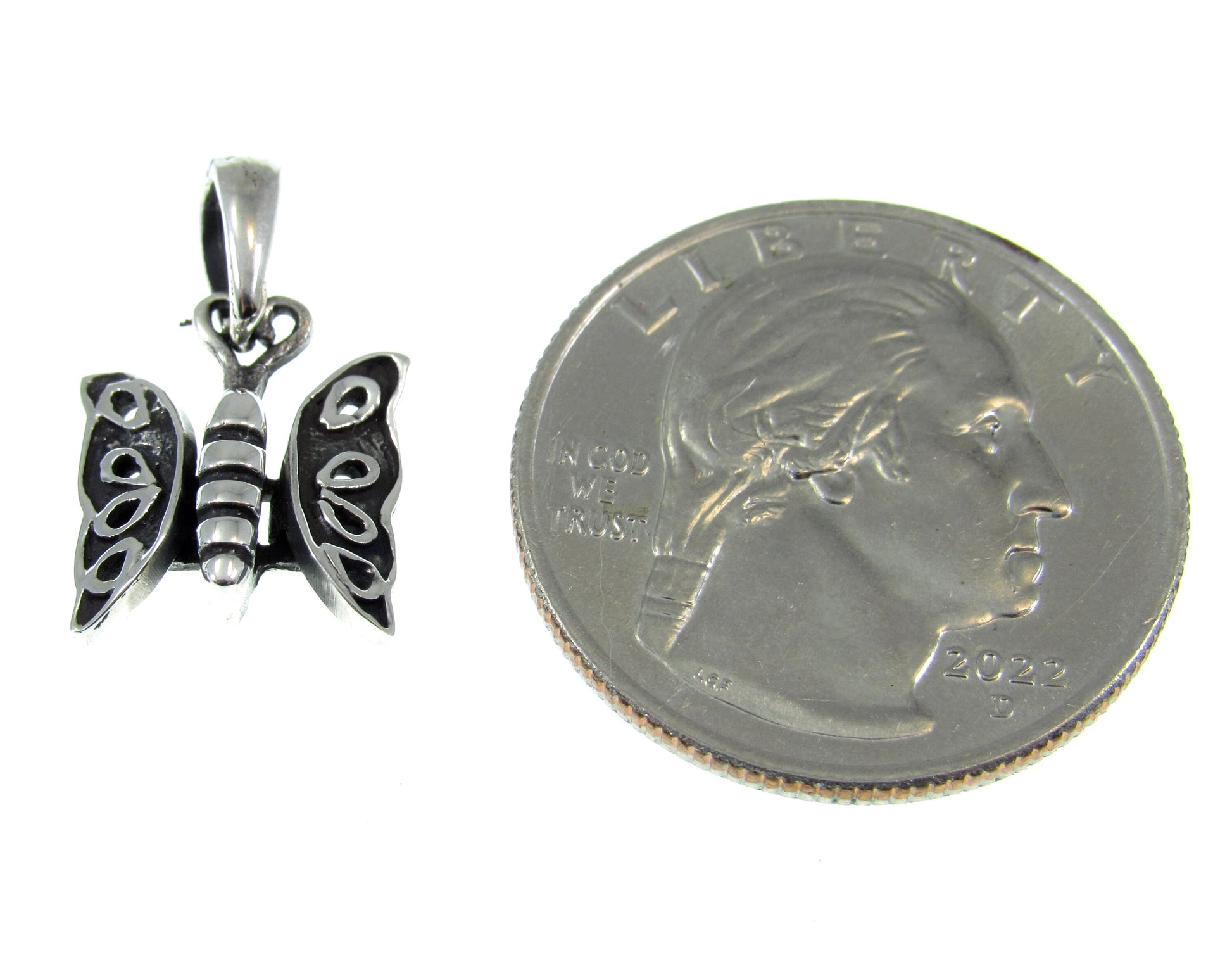 The solid sterling silver butterfly charm is smaller than a US quarter and measures 13/16 Inches long including the bail and 1/2 inch wide.