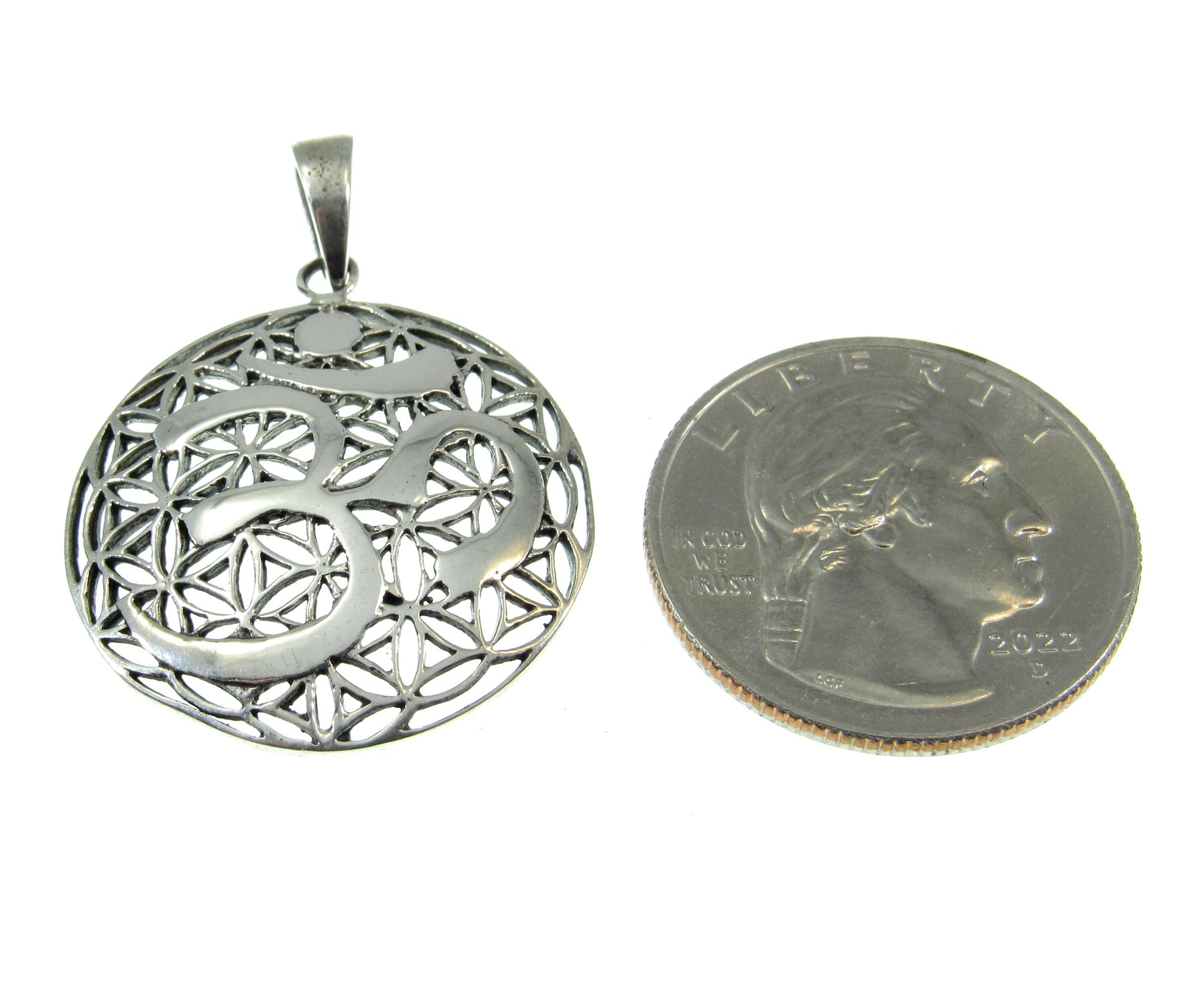 A bit larger than a US quarter, the OM flower of life pendant measures 1 3/8 inches long including bail and 1 inch wide.