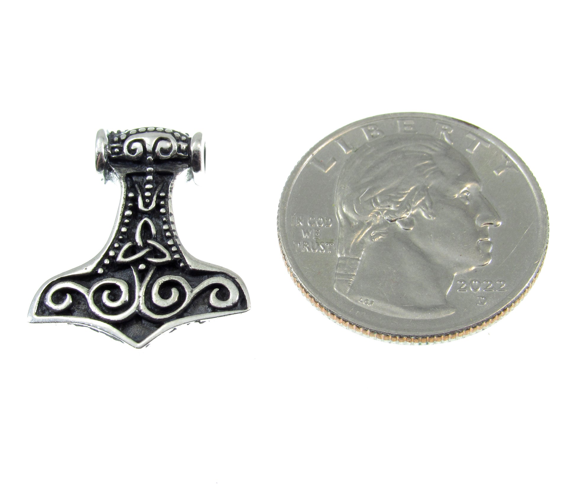 A bit smaller than a US quarter, the sterling silver Celtic Thor's hammer slide pendant measures 7/8 inches long by 3/4 inches wide
