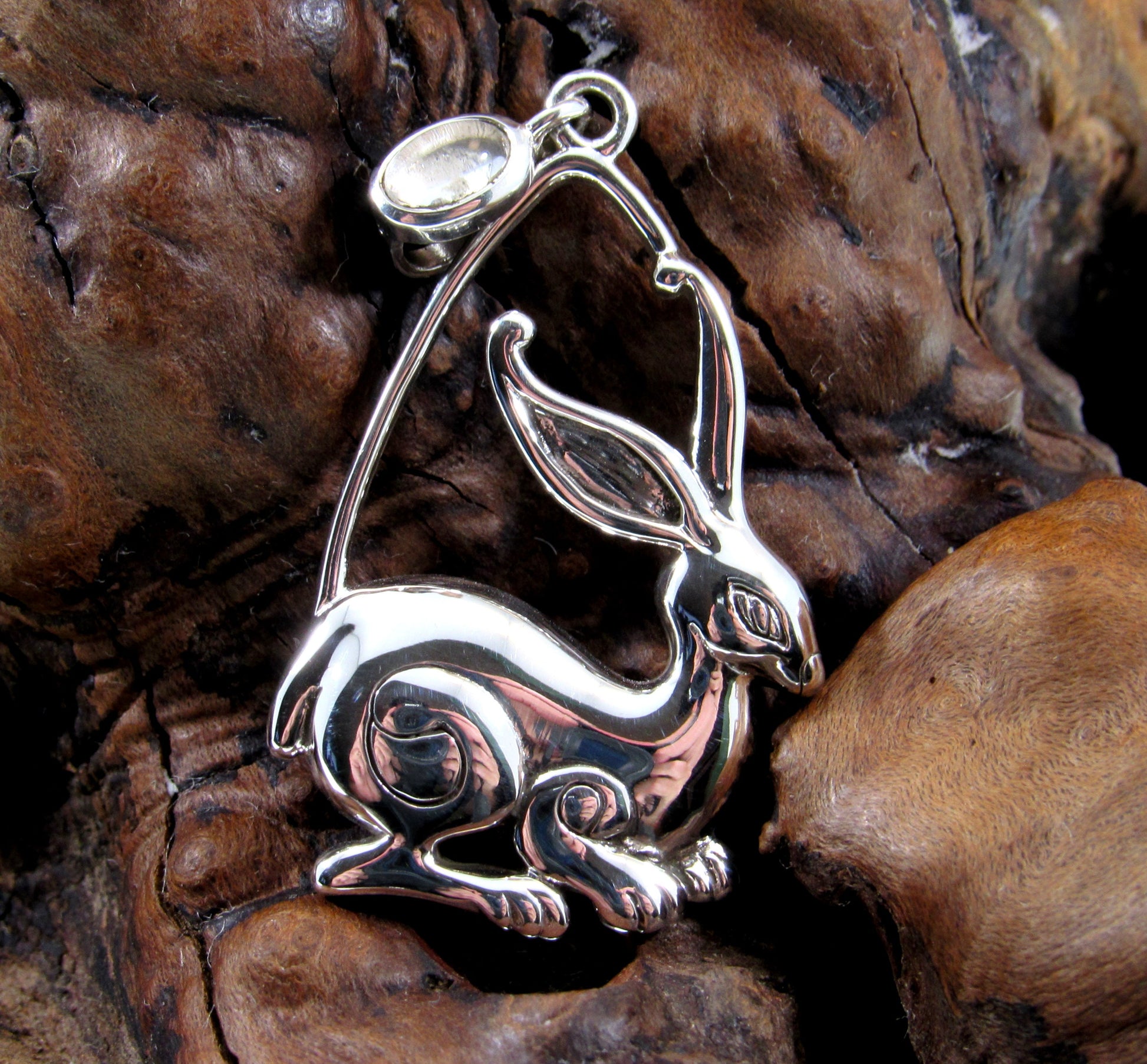 The sterling silver rabbit ostara pendant features a beautifully crafted bunny rabbit with a white quartz crystal set in the bail.
