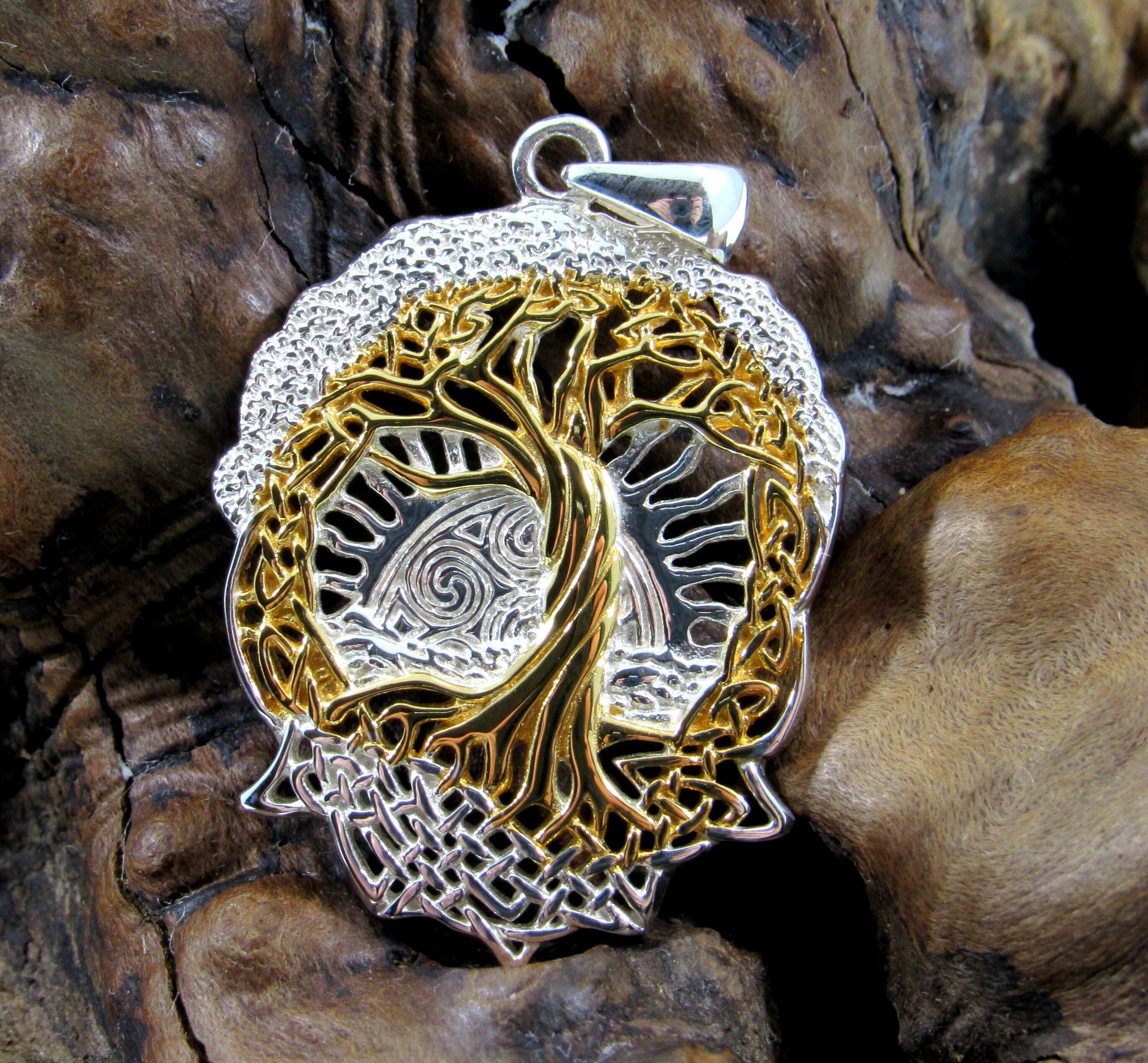 Designed by celebrated artist Courtney Davis, this tree of life pendant is a beautiful and unique interpretation of this sacred tree.